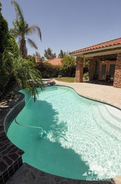 38 Santa Ynez Rancho Mirage, CA 92270 - Photo 36 of 38 a view of a swimming pool with a yard