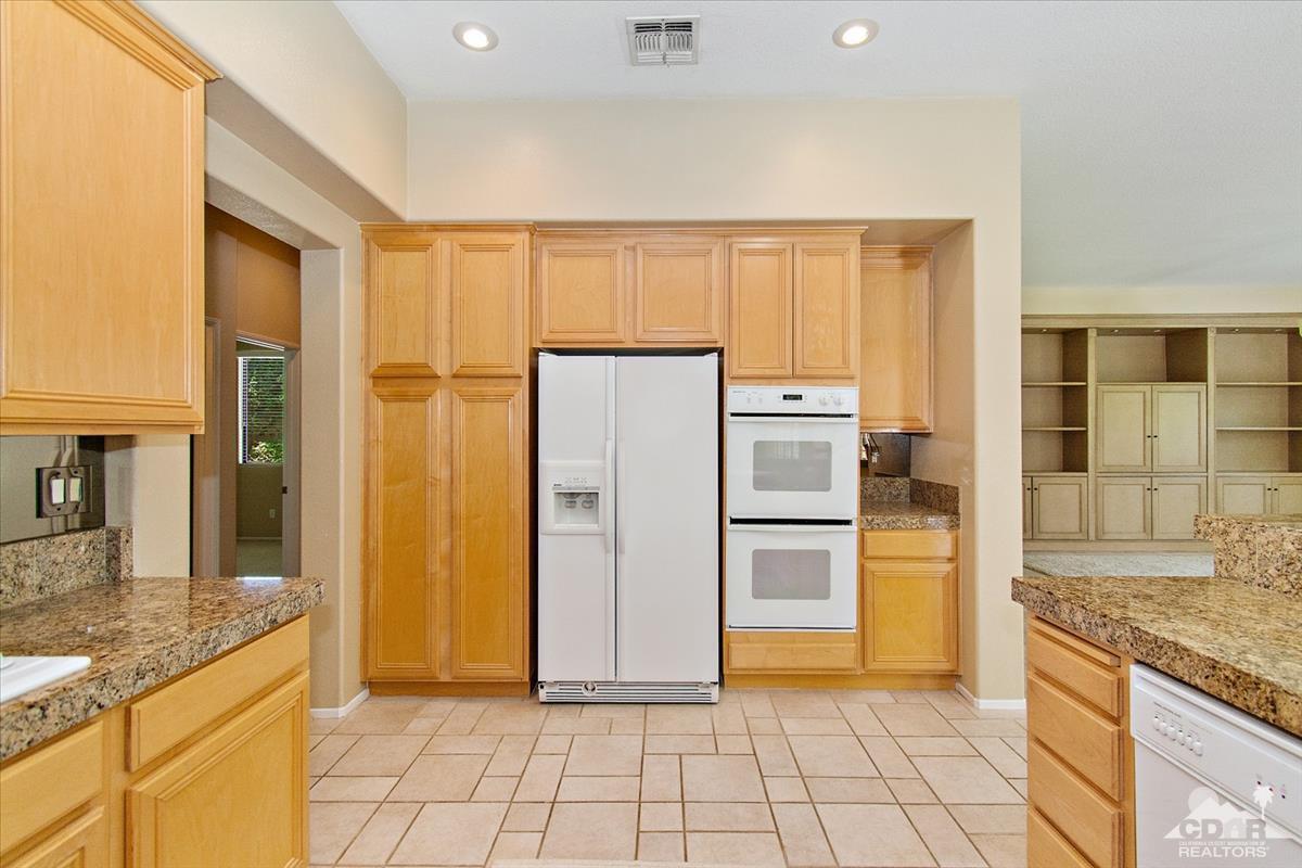 38 Santa Ynez Rancho Mirage, CA 92270 - Photo 10 of 38 a kitchen with a refrigerator a microwave and a sink