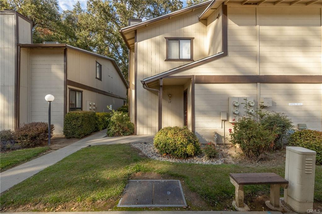 49400 River Park Road, Unit 17 Oakhurst, CA 93644 - Photo 20 of 34 a front view of a house with garden