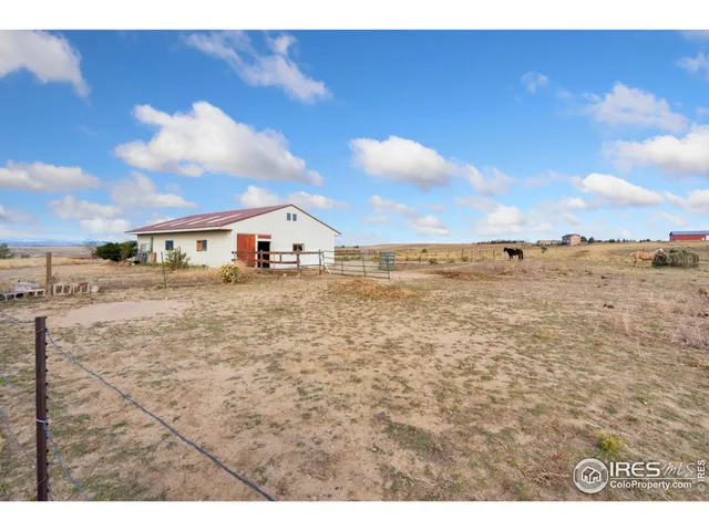 a view of a garage with a table and chairs