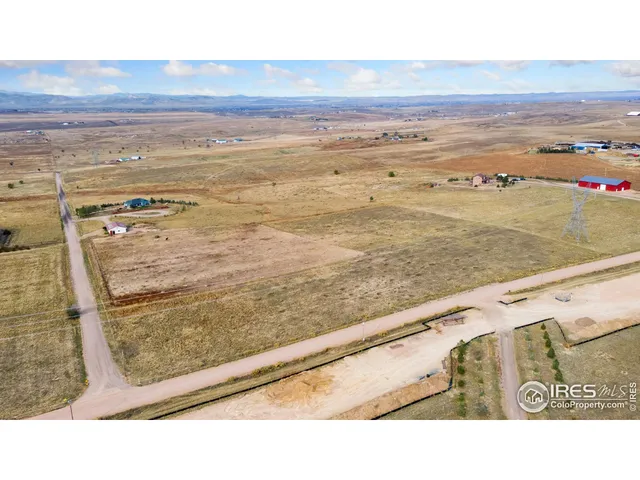 a picture of a bench in a white wall