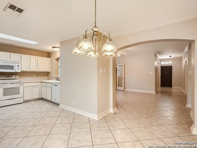 a view of a kitchen with a sink and cabinets