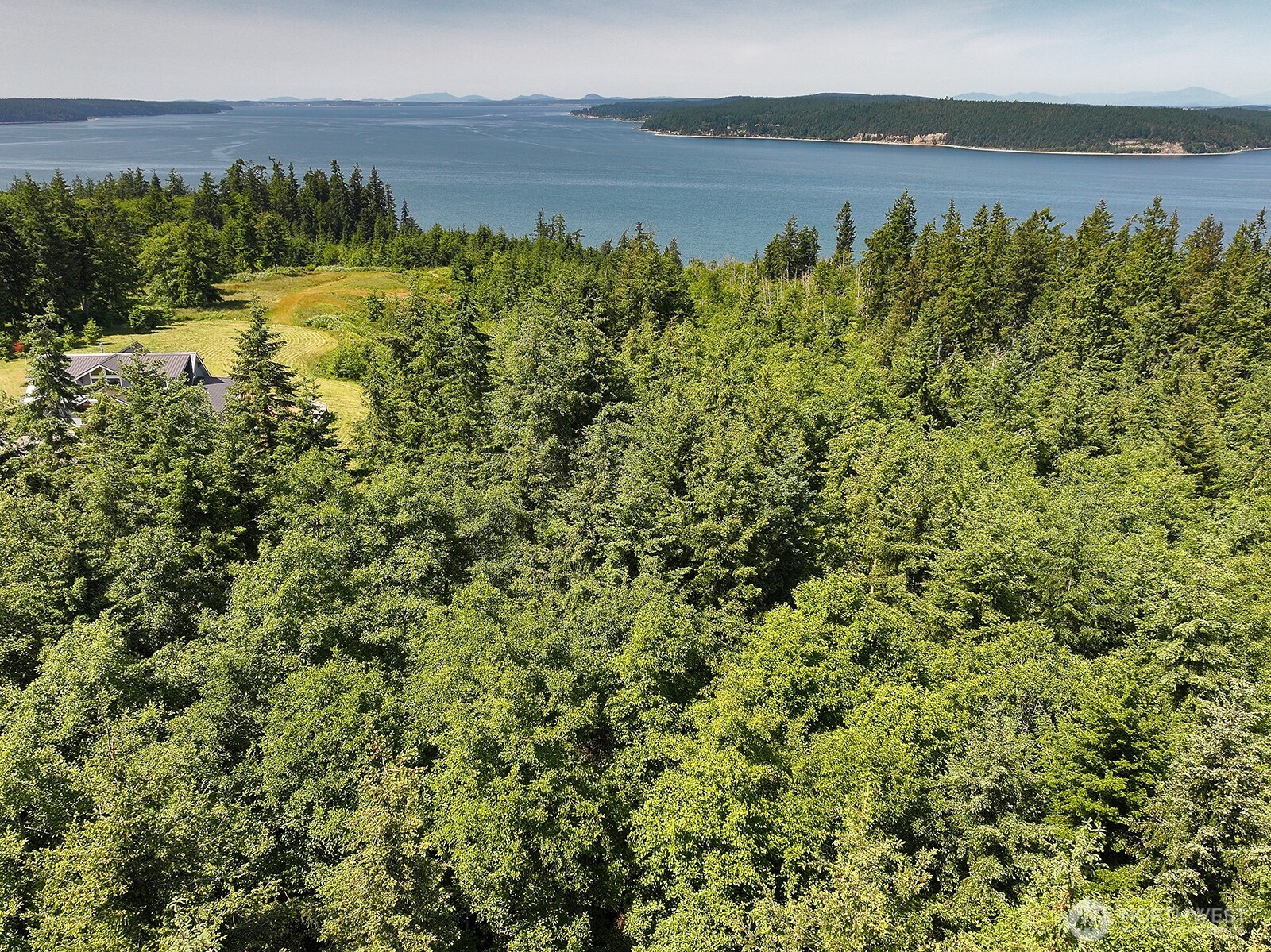-xxx Xxx Saratoga Ridge Road Langley, WA 98260 - Photo 20 of 24 a view of a lake with a yard
