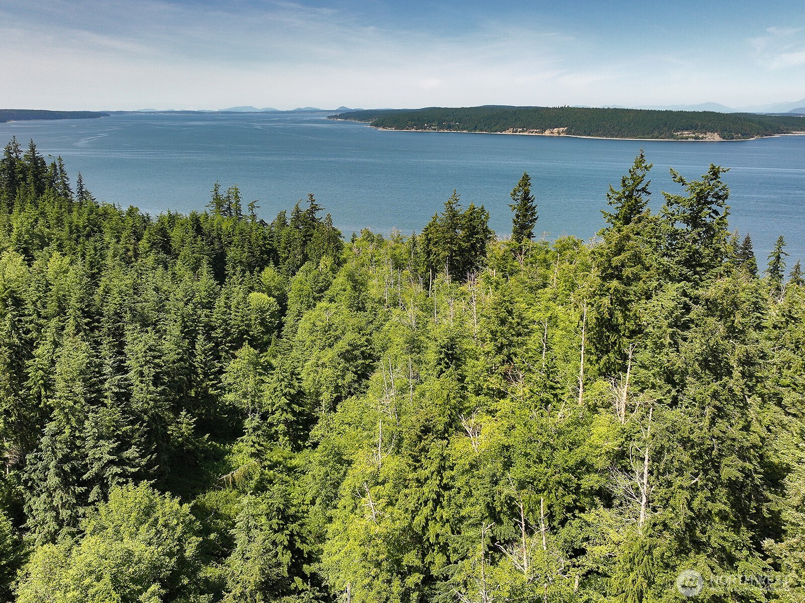 -xxx Xxx Saratoga Ridge Road Langley, WA 98260 - Photo 10 of 24 a view of a lake with an outdoor space