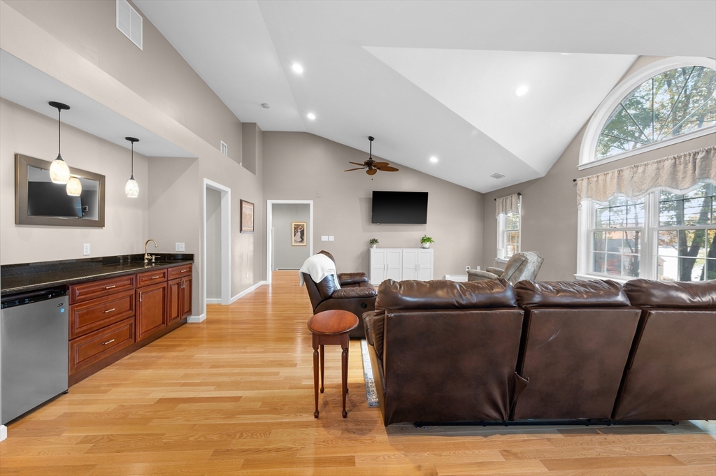 27 Downey Street Hopkinton, MA 01748 - Photo 18 of 36 a living room with furniture and a flat screen tv
