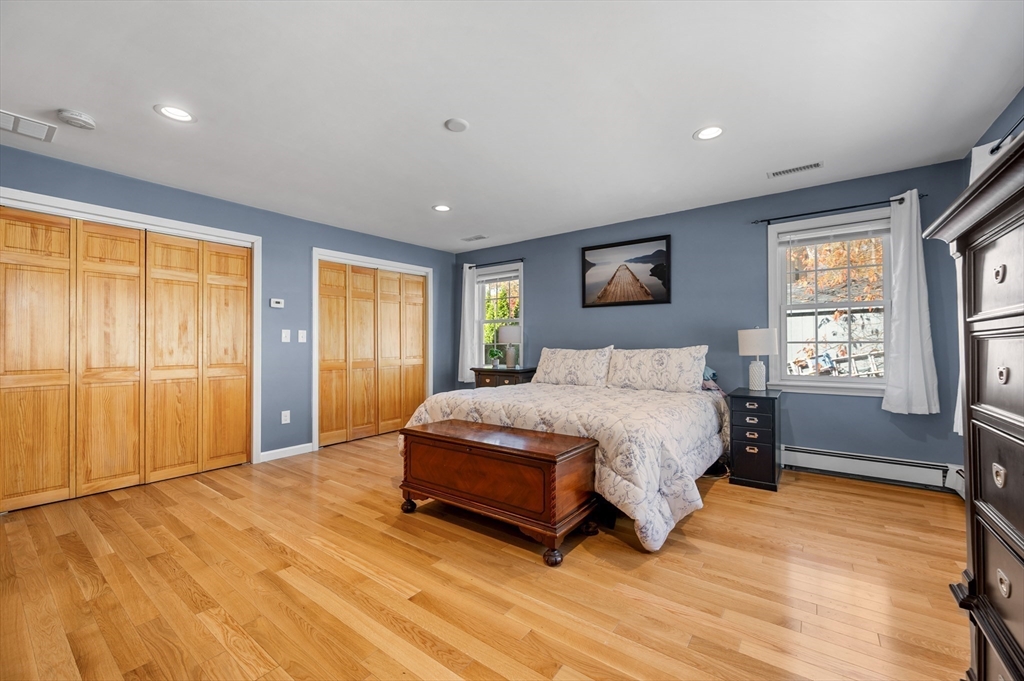 27 Downey Street Hopkinton, MA 01748 - Photo 20 of 36 a spacious bedroom with a bed and a window