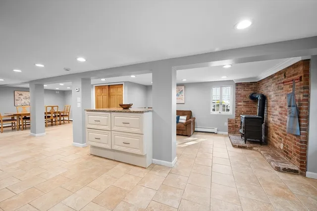 a view of a kitchen with furniture and a ceiling fan