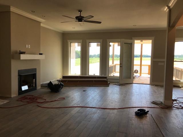 VIEW ACROSS THE GREAT ROOM.  LOTS OF HUGE WINDOWS!!