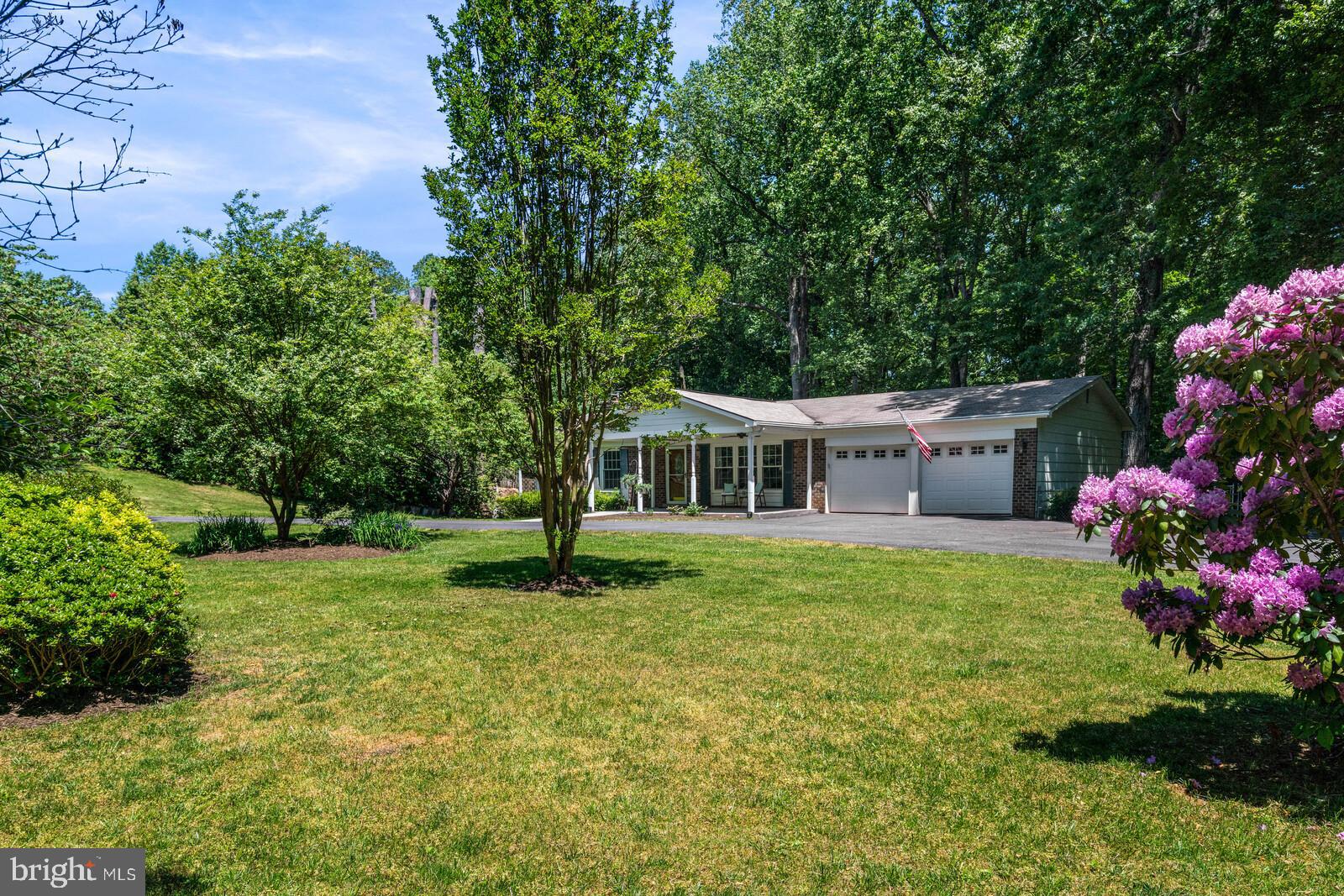6580 Davis Ford Road Manassas, VA 20111 - Photo 2 of 38 One acre lot with flowering trees.