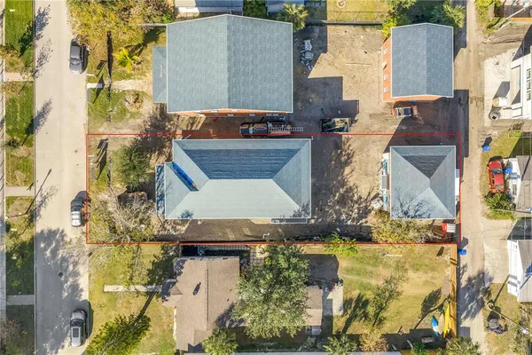 aerial view of a house with a yard