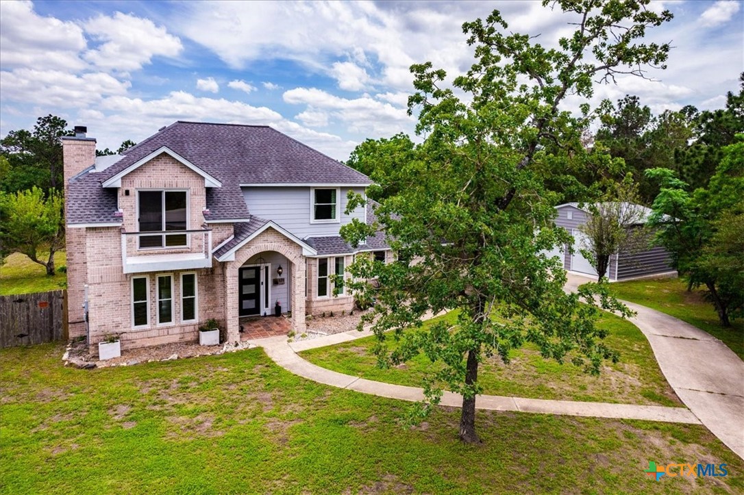 171 Pin Oak Crossing Elgin, TX 78621 - Photo 3 of 38 a front view of a house with garden