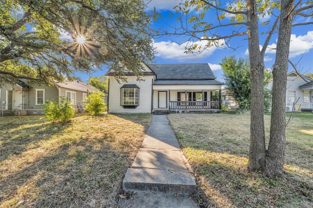 2524 McFerrin Avenue Waco, TX 76708 - Photo 4 of 29 Bungalow featuring a shingled roof, covered porch, and a front yard