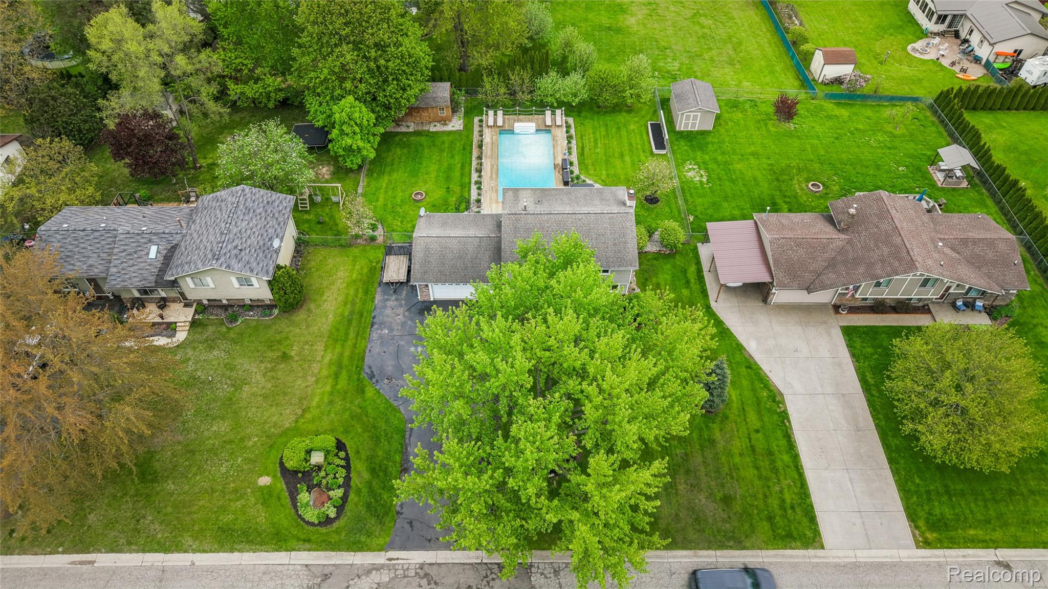 3891 Westlyn Road Lake Orion, MI 48359 - Photo 3 of 17 Aerial view of a pool