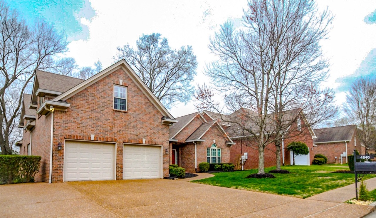 4840 Redcastle Ridge Nashville, TN 37211 - Photo 1 of 37 a front view of a house with a yard and garage