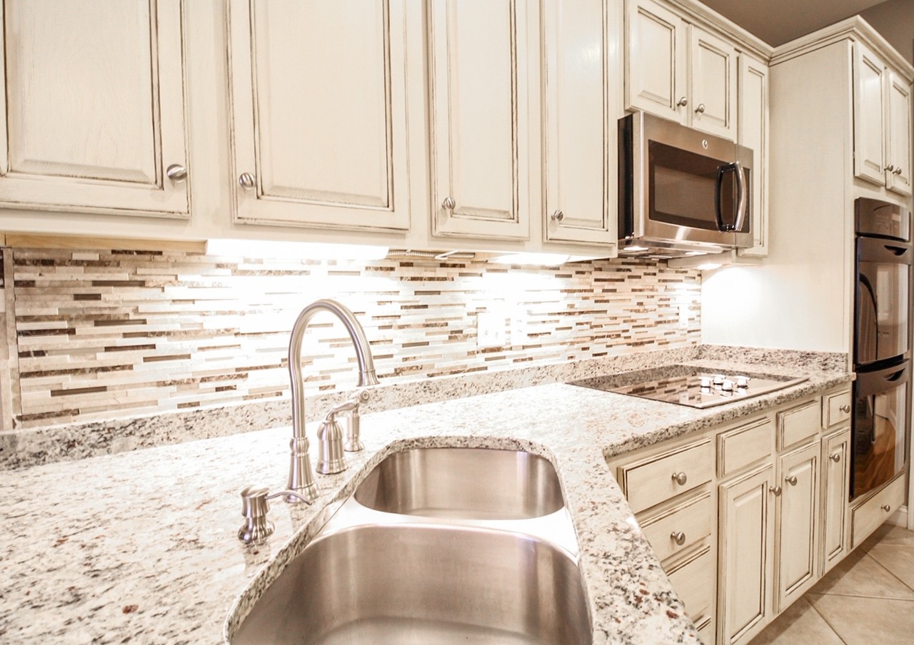 4840 Redcastle Ridge Nashville, TN 37211 - Photo 26 of 37 a kitchen with granite countertop white cabinets and white appliances