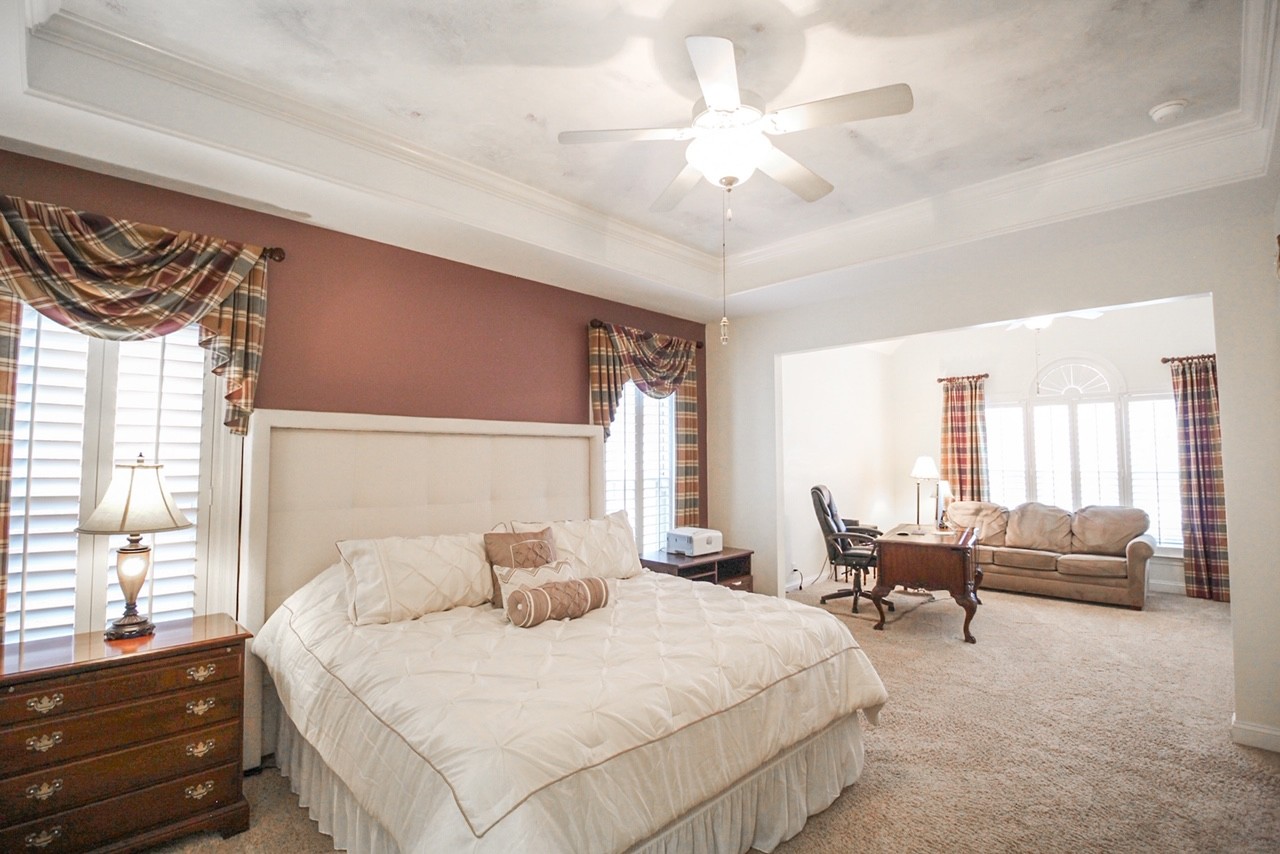 4840 Redcastle Ridge Nashville, TN 37211 - Photo 3 of 37 a bedroom with a large bed and a chandelier