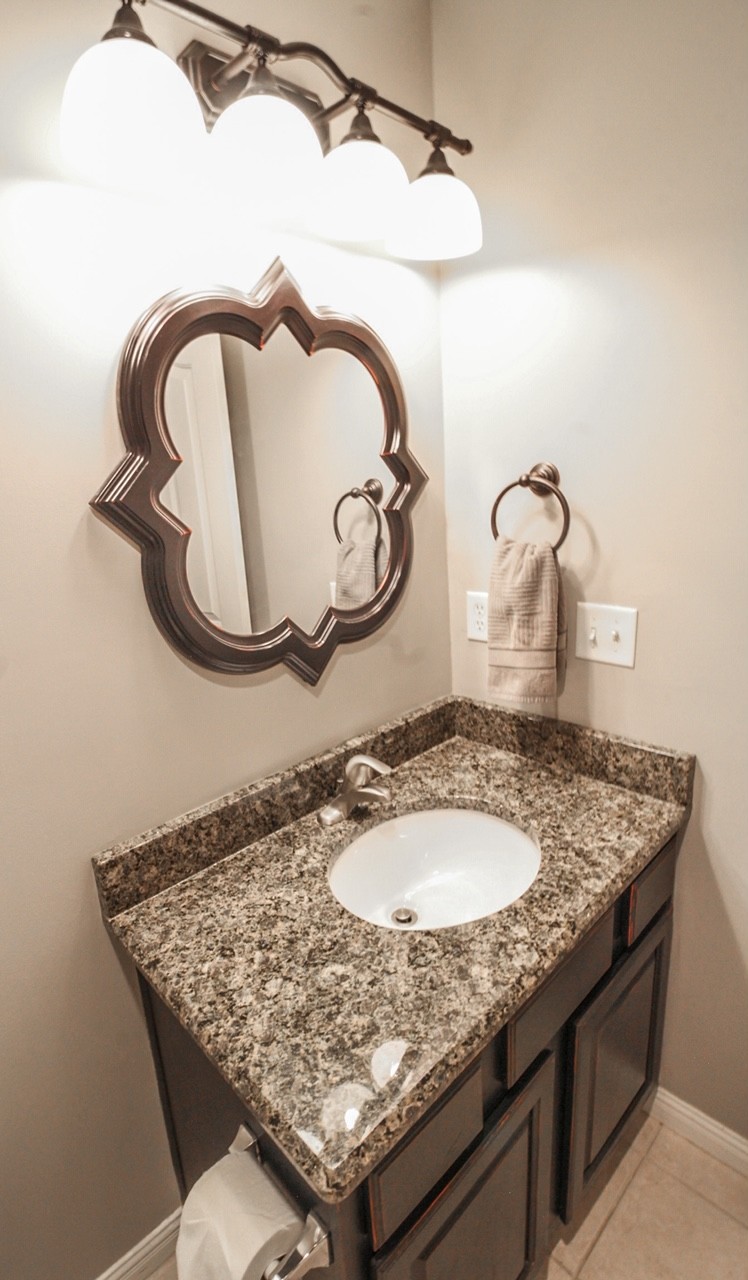 4840 Redcastle Ridge Nashville, TN 37211 - Photo 32 of 37 a bathroom with a granite countertop sink and a mirror