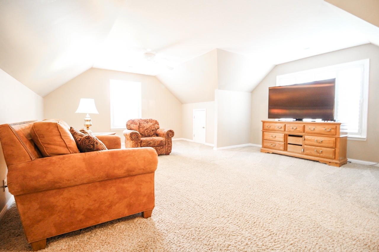 4840 Redcastle Ridge Nashville, TN 37211 - Photo 9 of 37 a living room with furniture and a flat screen tv