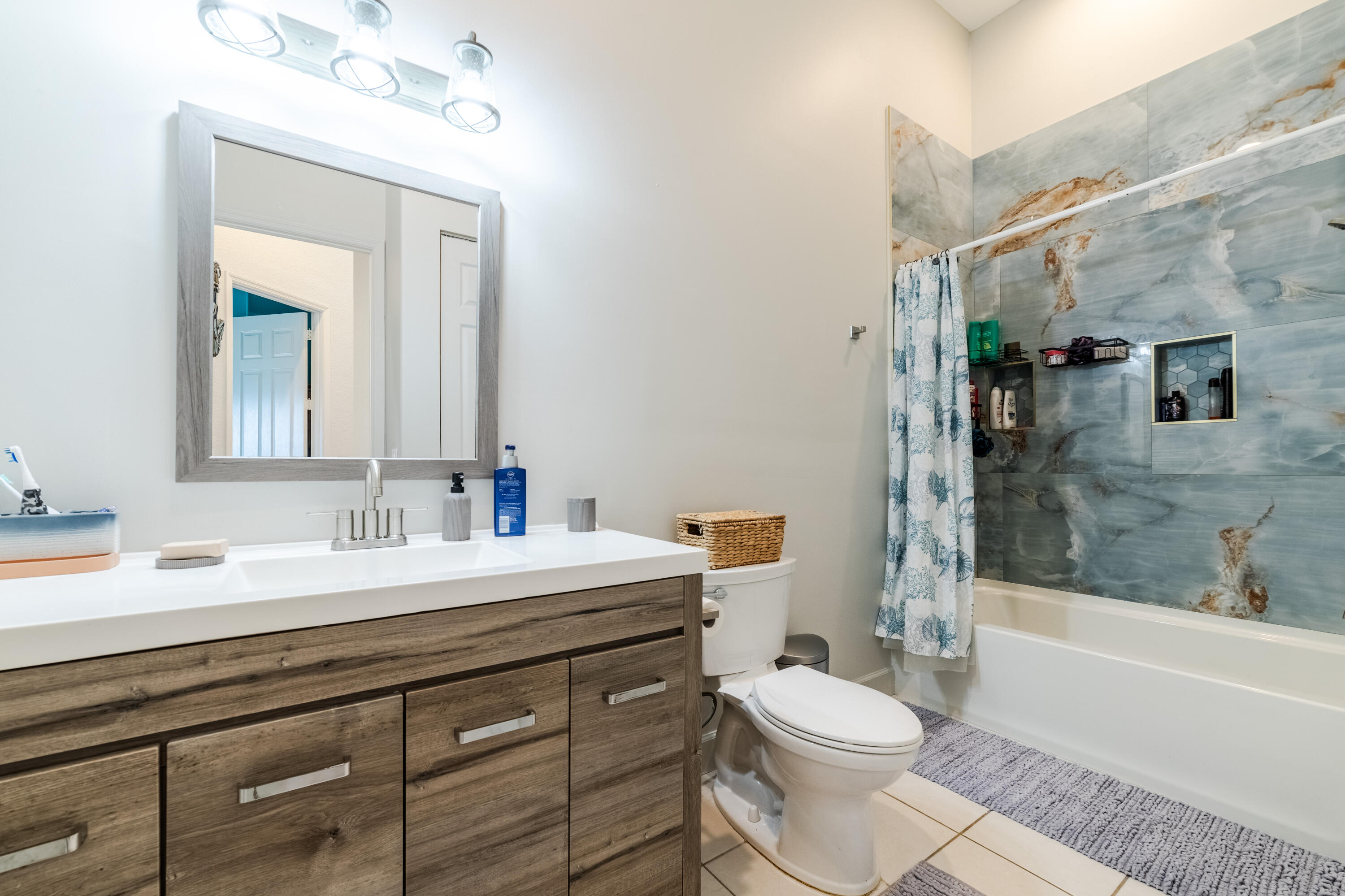 136 Spruce Street Boynton Beach, FL 33426 - Photo 12 of 24 a bathroom with a sink a toilet and shower