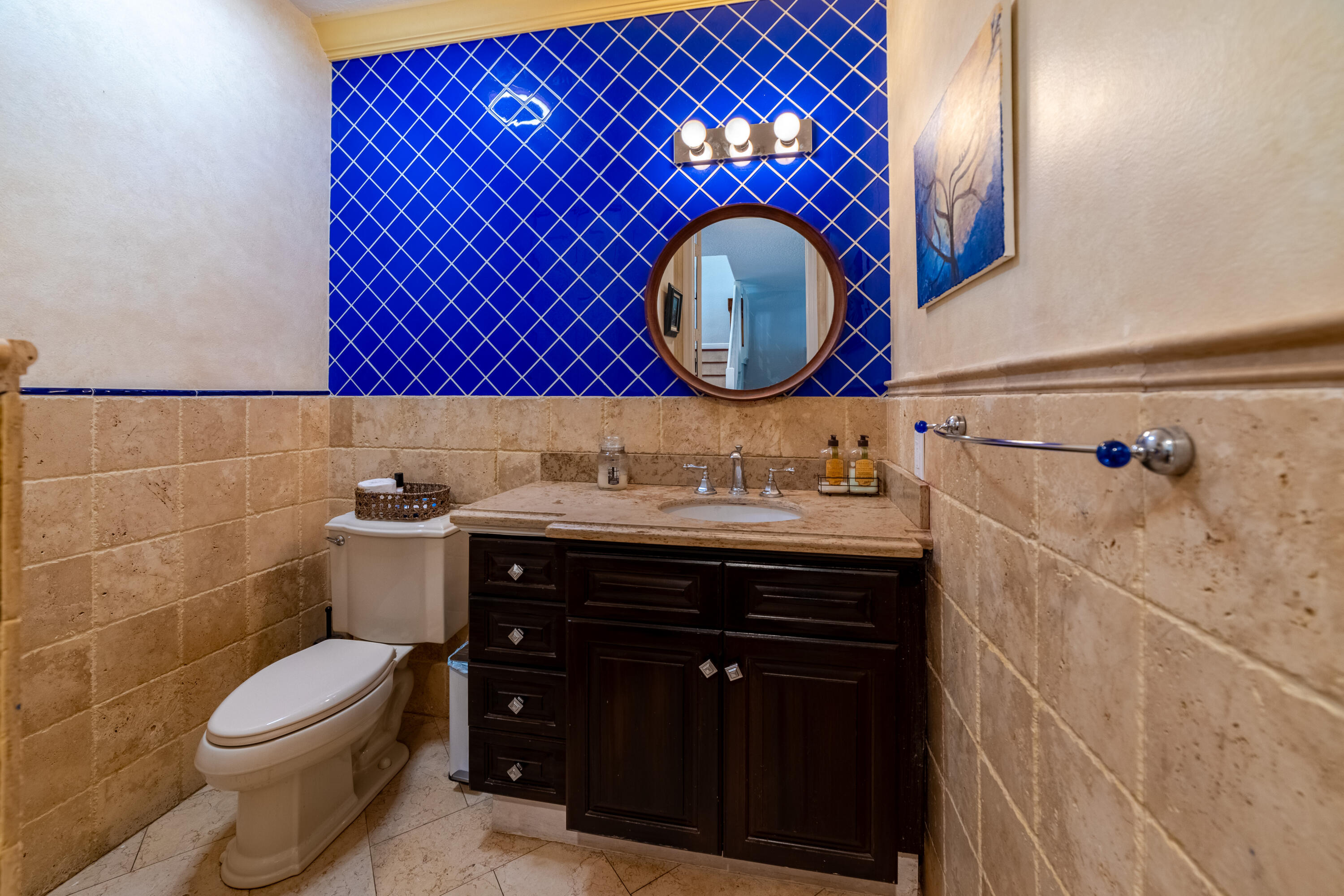 136 Spruce Street Boynton Beach, FL 33426 - Photo 13 of 24 a bathroom with a sink a mirror and a toilet
