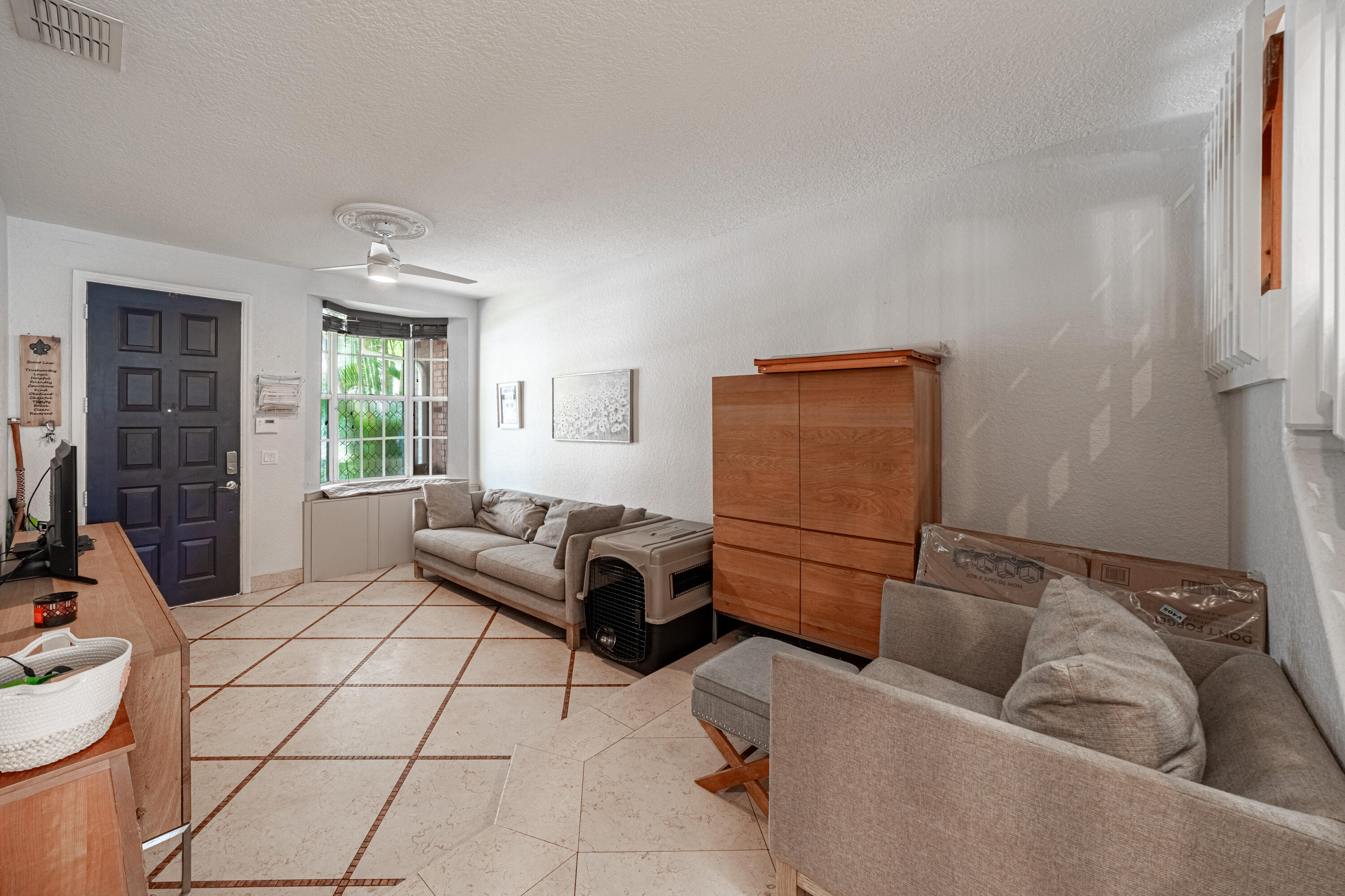 136 Spruce Street Boynton Beach, FL 33426 - Photo 18 of 24 a living room with furniture and a window