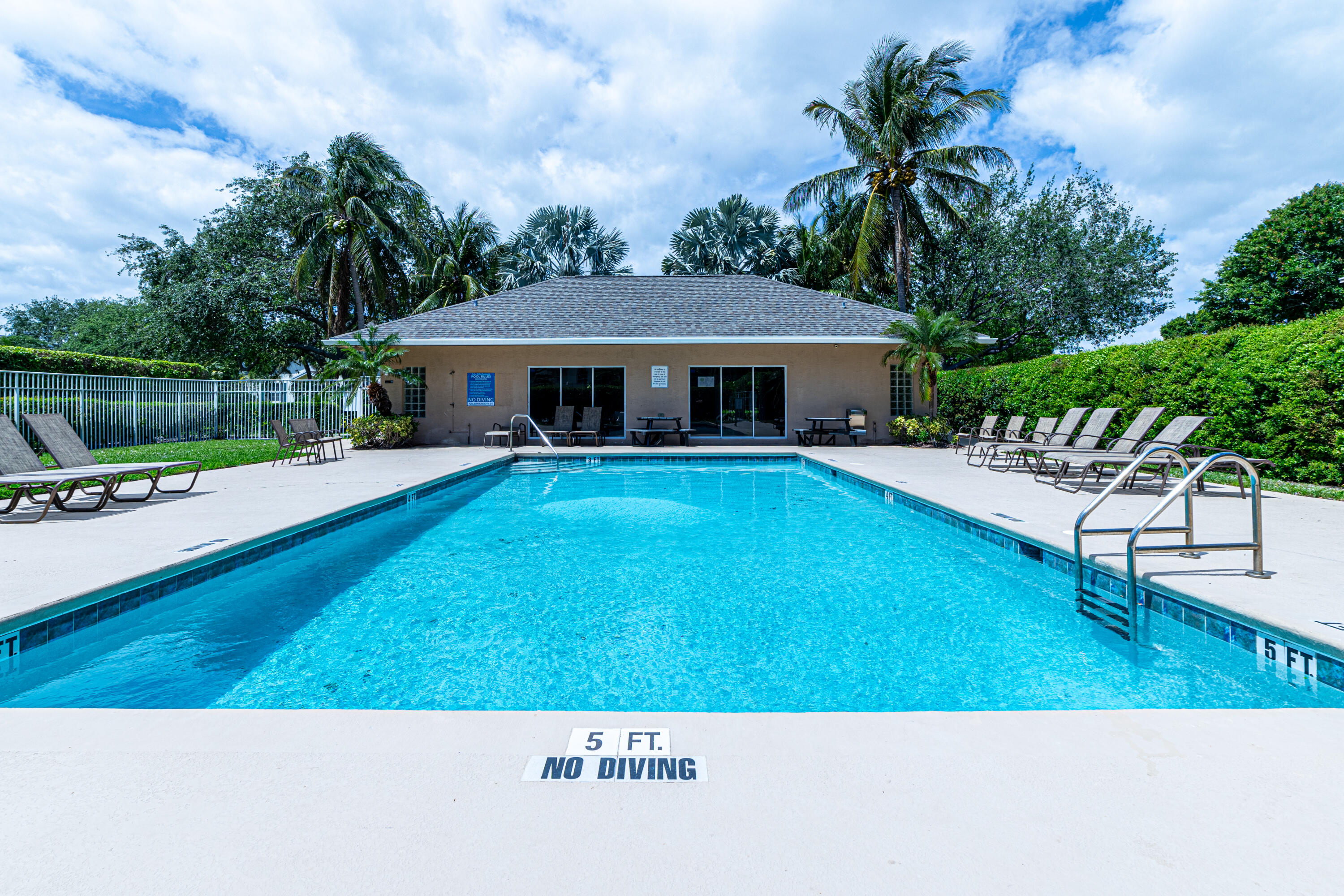136 Spruce Street Boynton Beach, FL 33426 - Photo 22 of 24 a view of a house with a yard patio and fire pit