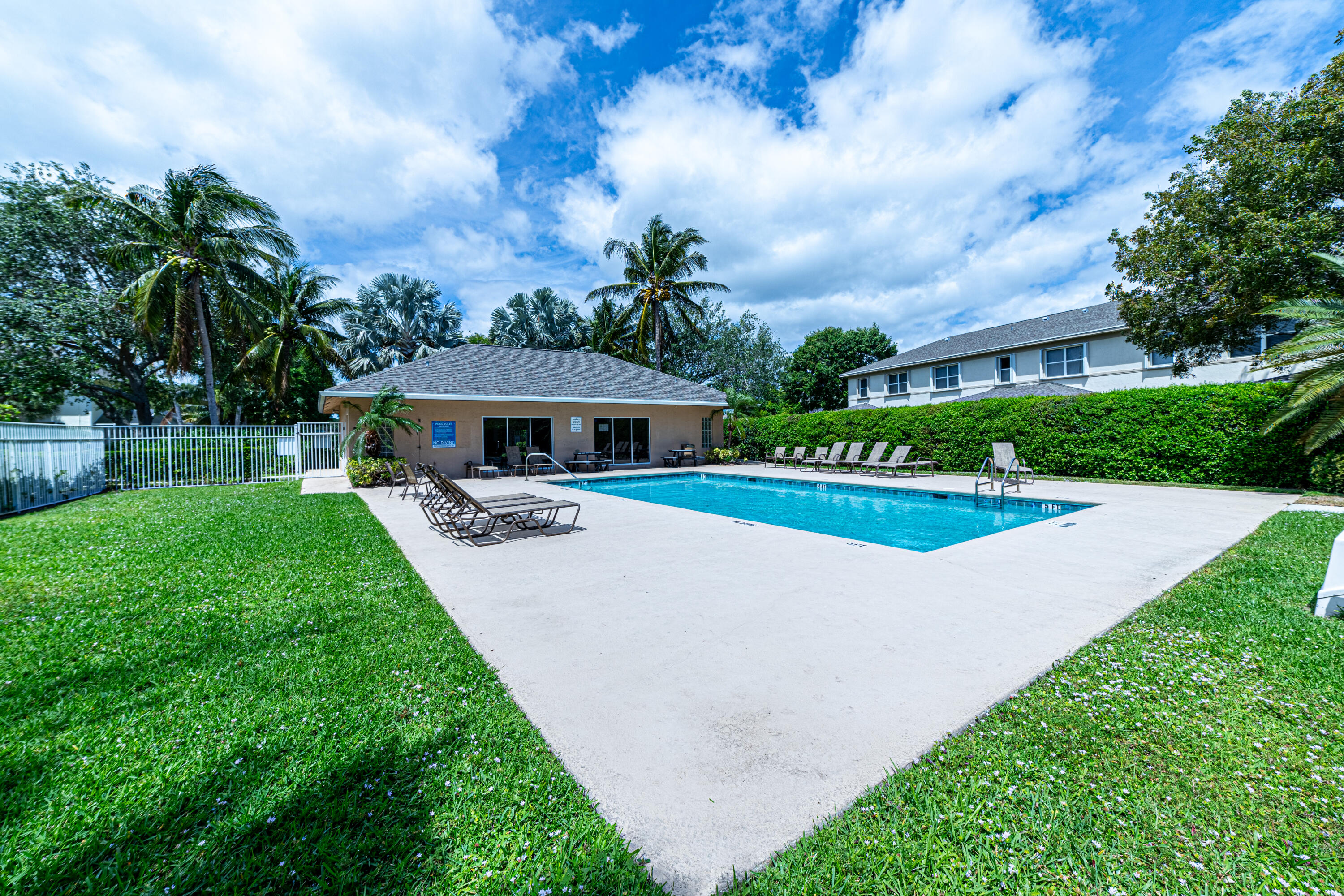 136 Spruce Street Boynton Beach, FL 33426 - Photo 23 of 24 a view of house with swimming pool and garden