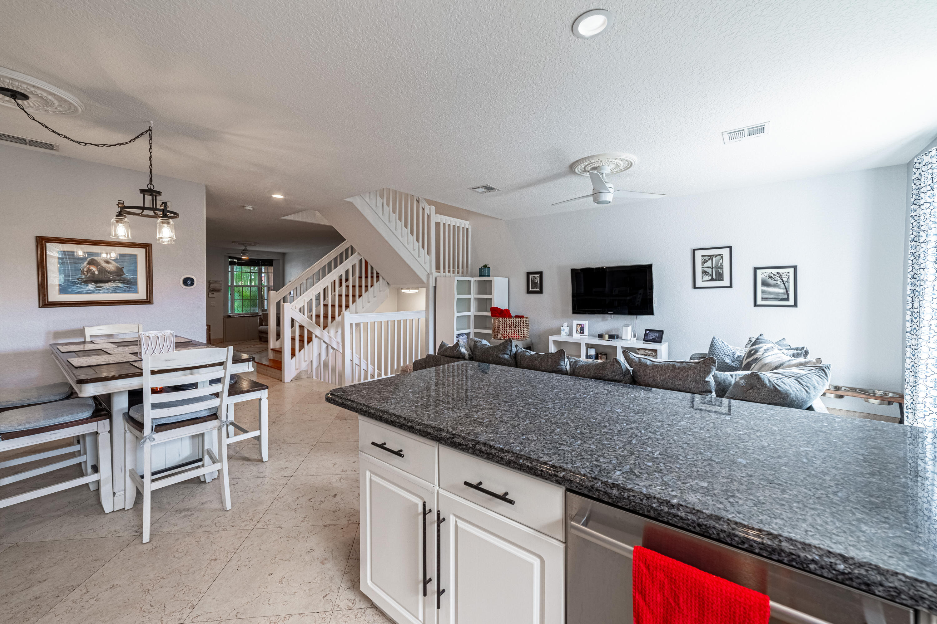 136 Spruce Street Boynton Beach, FL 33426 - Photo 5 of 24 a kitchen with a table and chairs in it