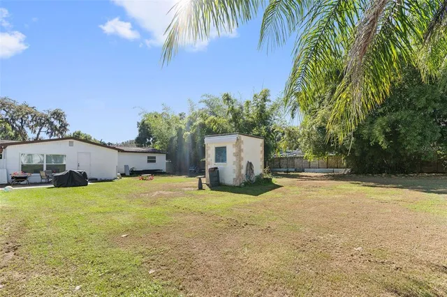 a house with swimming pool in front of it