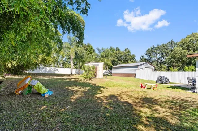 a view of backyard with green space