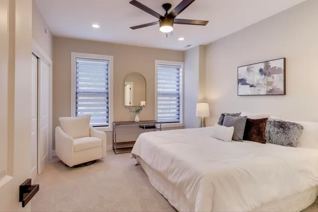 a bedroom with bed and window