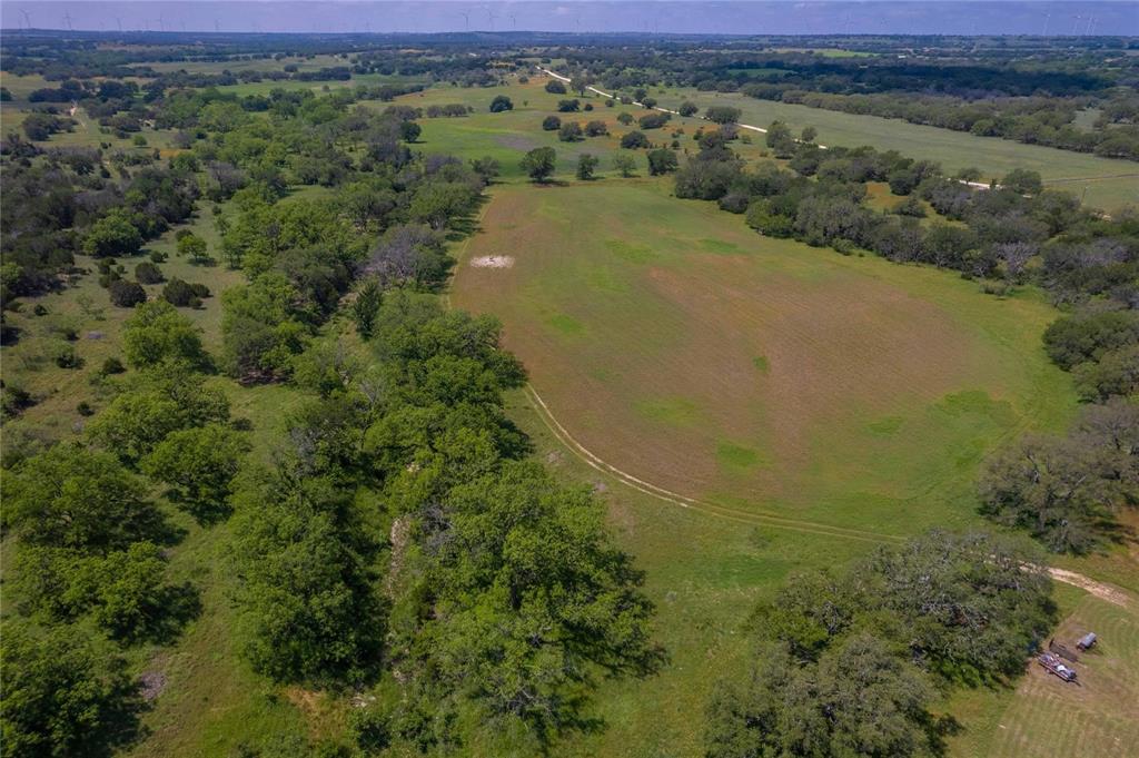 180 County Road 140 Comanche, TX 76442 - Photo 14 of 17 a view of a lake with a mountain in the background