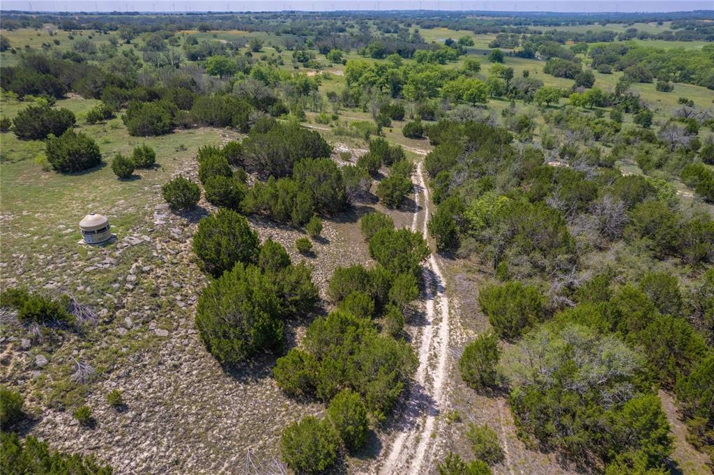 180 County Road 140 Comanche, TX 76442 - Photo 4 of 17 an aerial view of a house with a yard