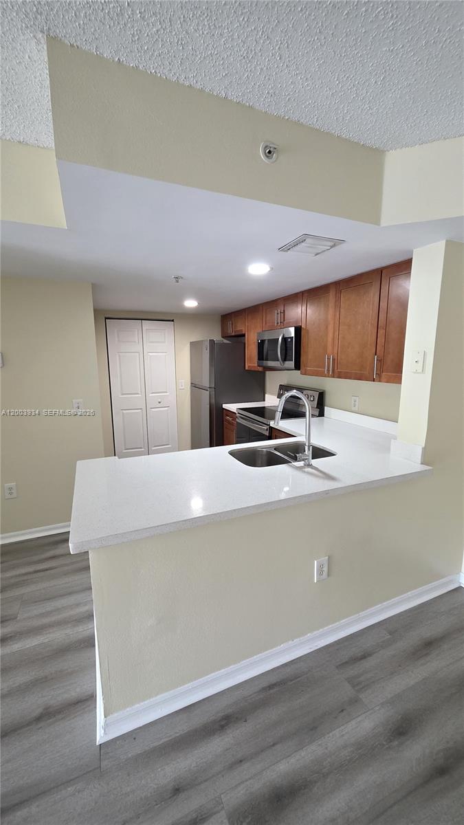 5051 Wiles Road, Unit 201 Coconut Creek, FL 33073 - Photo 11 of 43 a view of kitchen with stainless steel appliances granite countertop refrigerator sink and stove