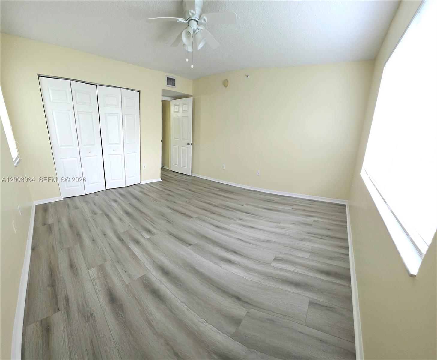 5051 Wiles Road, Unit 201 Coconut Creek, FL 33073 - Photo 24 of 43 a view of an empty room with a window