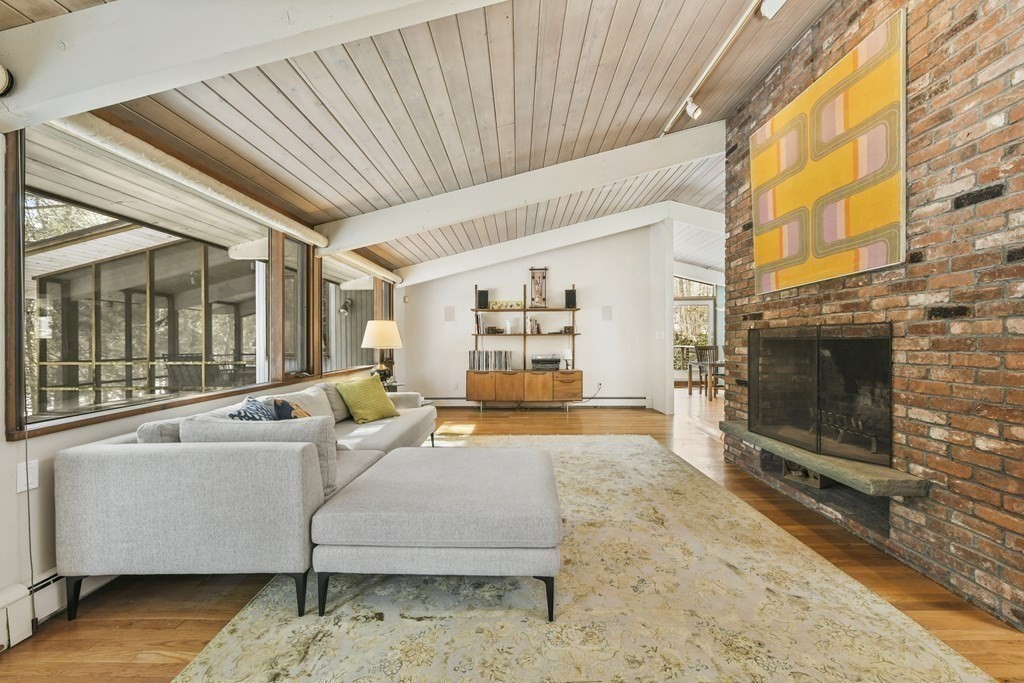 87 Wolf Rock Road Carlisle, MA 01741 - Photo 11 of 28 a living room with furniture and a fireplace