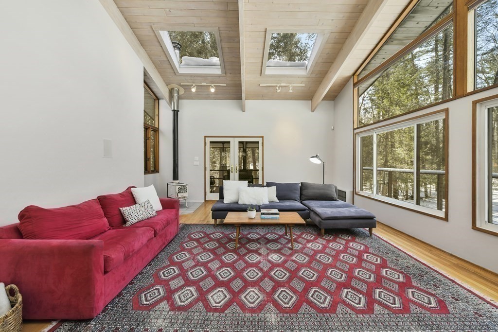 87 Wolf Rock Road Carlisle, MA 01741 - Photo 15 of 28 a living room with furniture or couch and a large window
