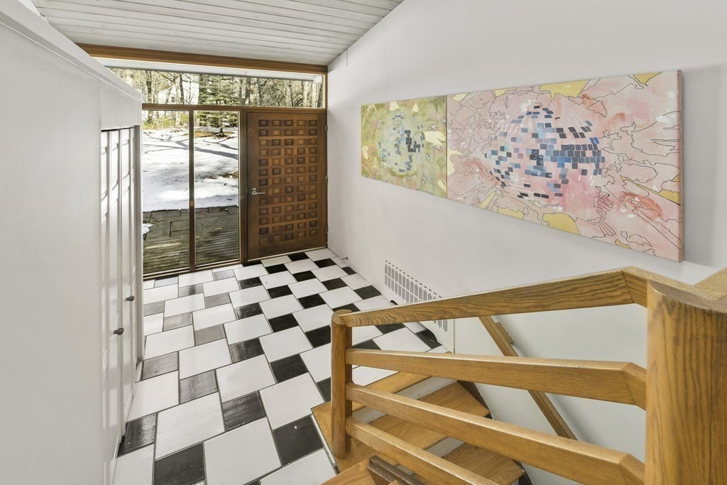 87 Wolf Rock Road Carlisle, MA 01741 - Photo 16 of 28 a bathroom with a black and white checkered floor