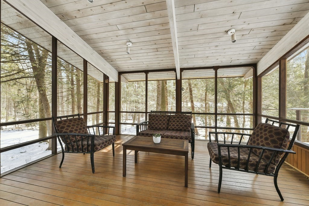 87 Wolf Rock Road Carlisle, MA 01741 - Photo 24 of 28 a living room with furniture and wooden floor