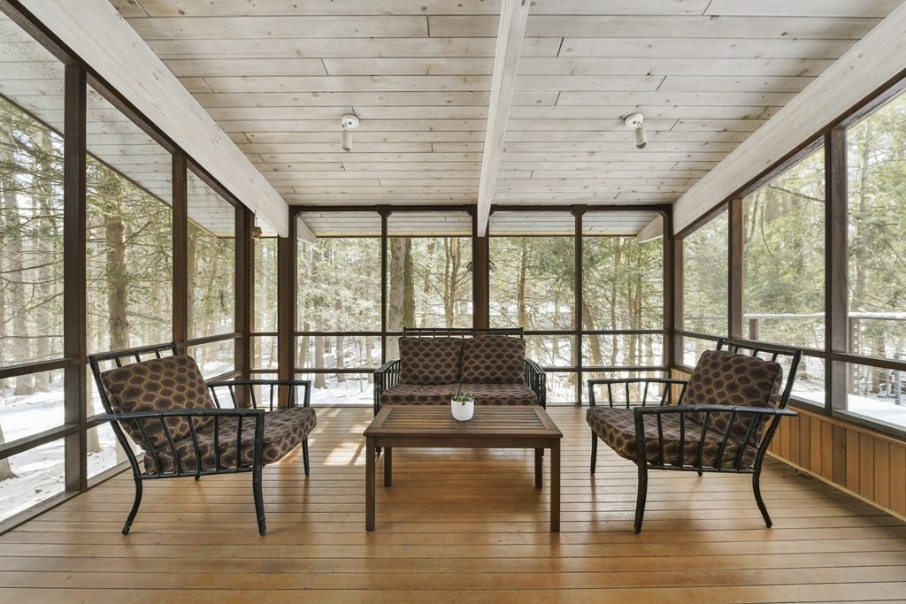 87 Wolf Rock Road Carlisle, MA 01741 - Photo 25 of 28 a view of a dining room with furniture window and wooden floor