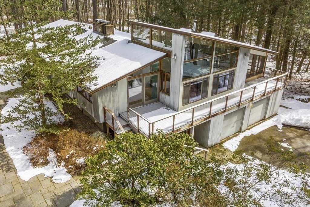 87 Wolf Rock Road Carlisle, MA 01741 - Photo 26 of 28 a house with trees in front of it