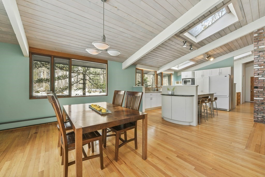 87 Wolf Rock Road Carlisle, MA 01741 - Photo 7 of 28 a view of a dining room with furniture window and wooden floor