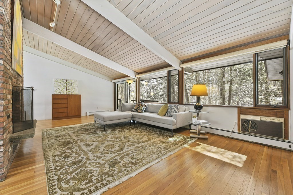 87 Wolf Rock Road Carlisle, MA 01741 - Photo 9 of 28 a living room with furniture and a large window