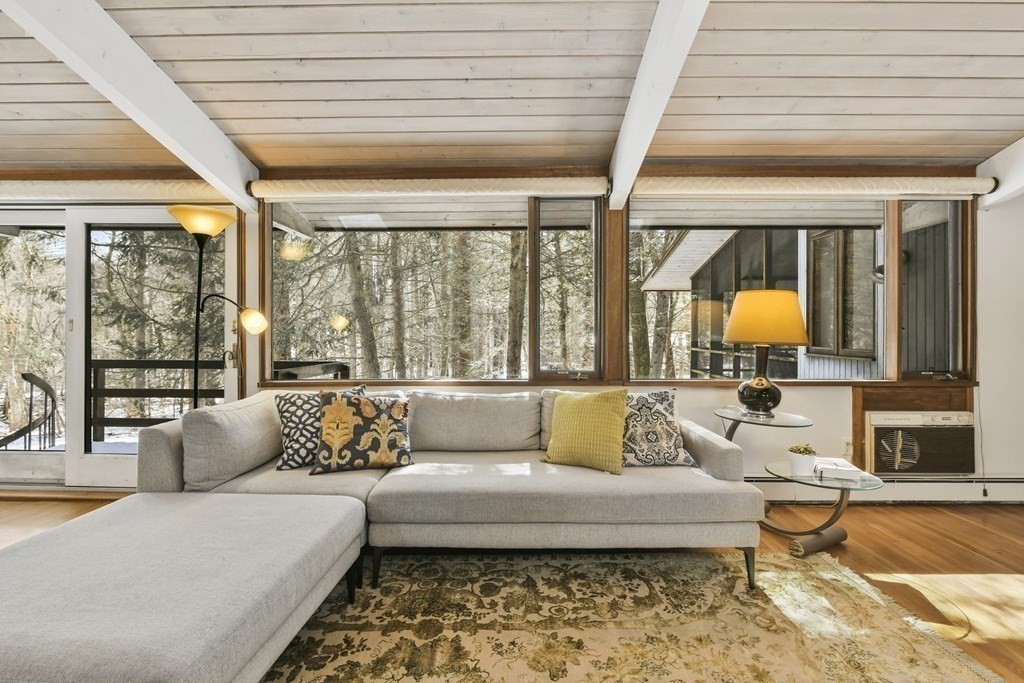 87 Wolf Rock Road Carlisle, MA 01741 - Photo 10 of 28 a living room with furniture and a large window