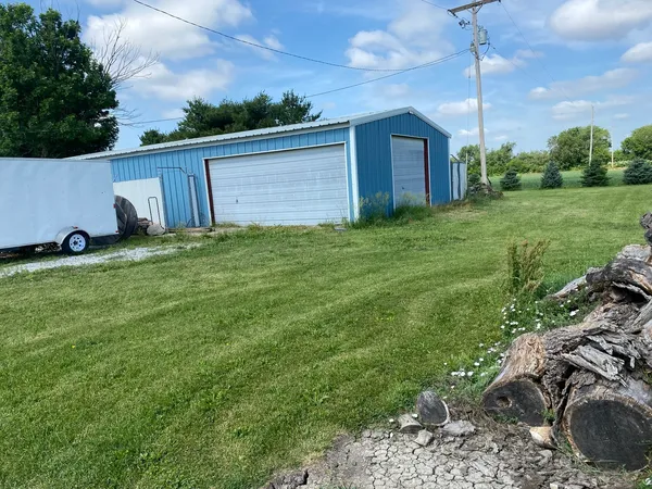a view of a backyard with potted plants