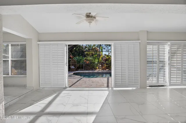 a bathroom with a glass shower door