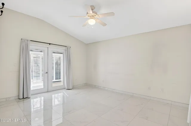 an aerial view of a house with a yard and garden