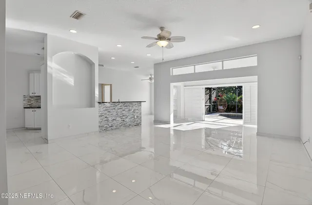 a view of a hallway with windows