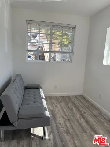 a view of balcony with furniture