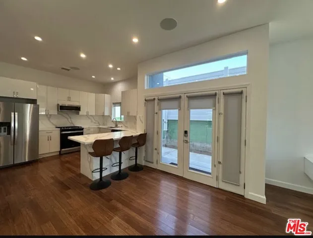a bathroom with a tub a sink and a shower